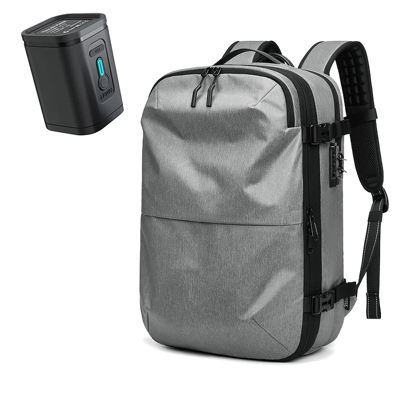 Gray backpack with black straps and a power bank on a white background